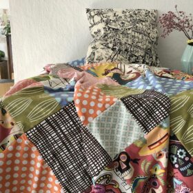 Patchworkdecke mit Quadraten im Mexiko-Style